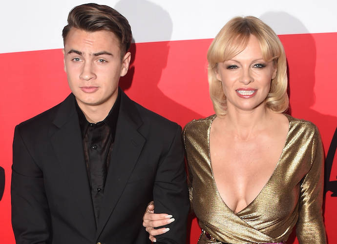 Brandon Lee Joins Mom Pamela Anderson At ‘The Gunman’ Premiere