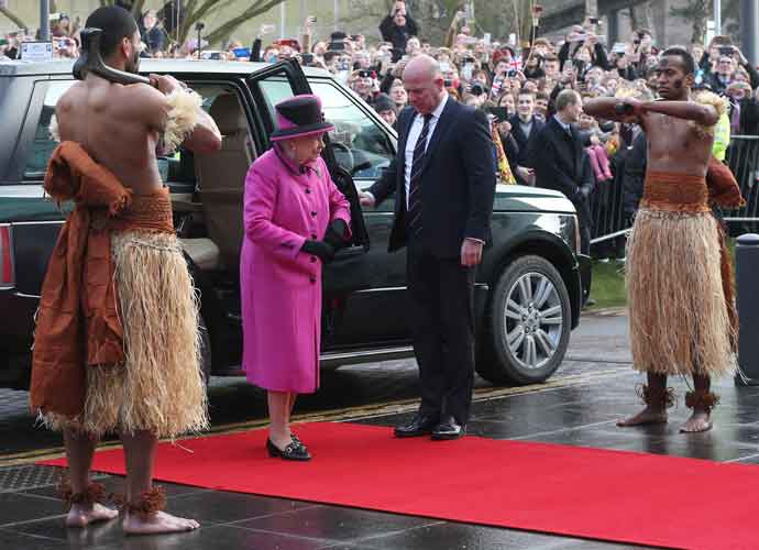 Queen Elizabeth Visits Fijian Exhibition, Greeted By Shirtless Wariors