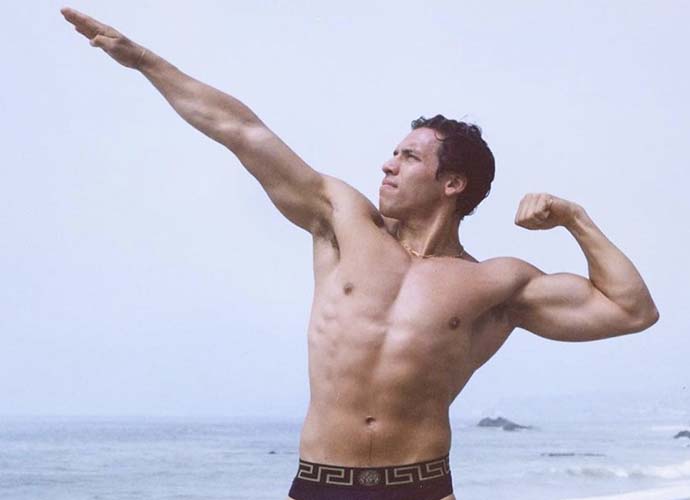 Joseph Baena Channels His Famous Dad Arnold Schwarzenegger’s Icon Beach Pose