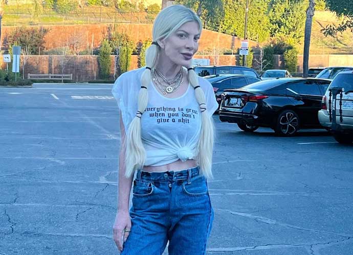 After Living In A Trailer Park In ’23, Tori Spelling Gives The Finger To Her Haters & Embraces ’24