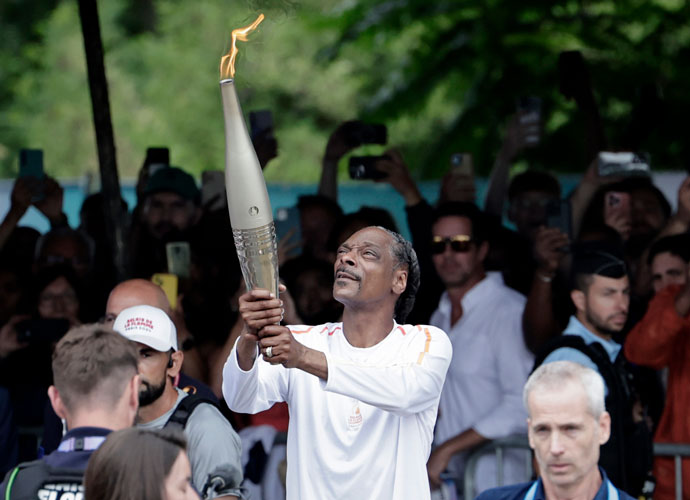 Snoop Dogg Carries The Olympic Torch Creating First Iconic Moment At