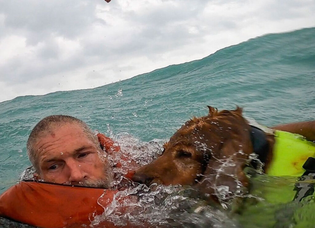 Photo Of Coast Guard Rescuing Man & His Dog From Boat Stranded In Hurricane Helene Goes Viral