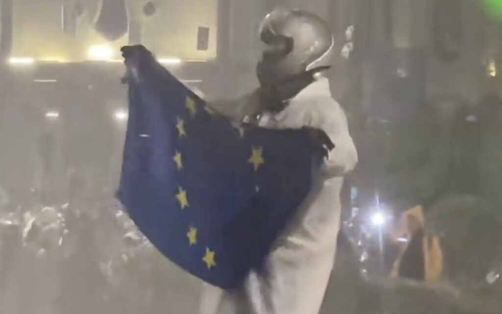 VIDEO: Protester Dances With EU Flag as Police Spray Water Cannons