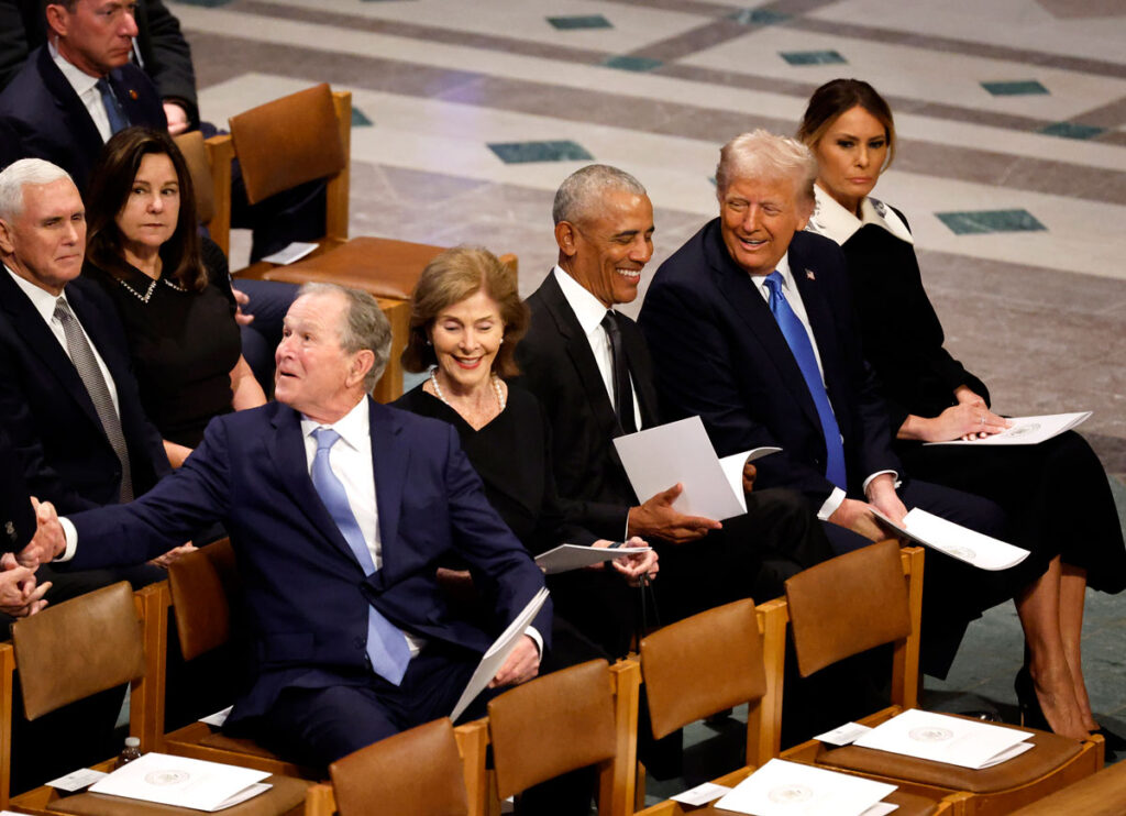 Obama & Trump Laugh During Friendly Exchange At Jimmy Carter’s Funeral After Trump Rails Against Flag Flying At Half-Mast