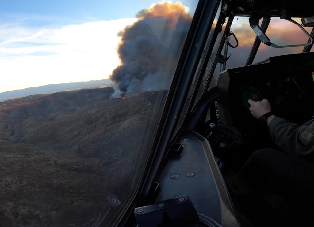 VIDEO: Aerial View As California Air National Guard Drops Retardant On Hughes Fires In L.A.