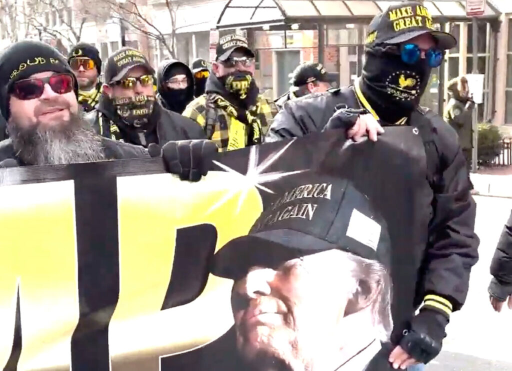 VIDEO: Right-Wing Proud Boys Group Marches In D.C. With Banner Congratulating President Trump