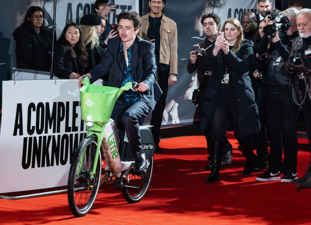 Timothée Chalamet Rides An E-Bike To ‘A Complete Unknown’ London Premiere