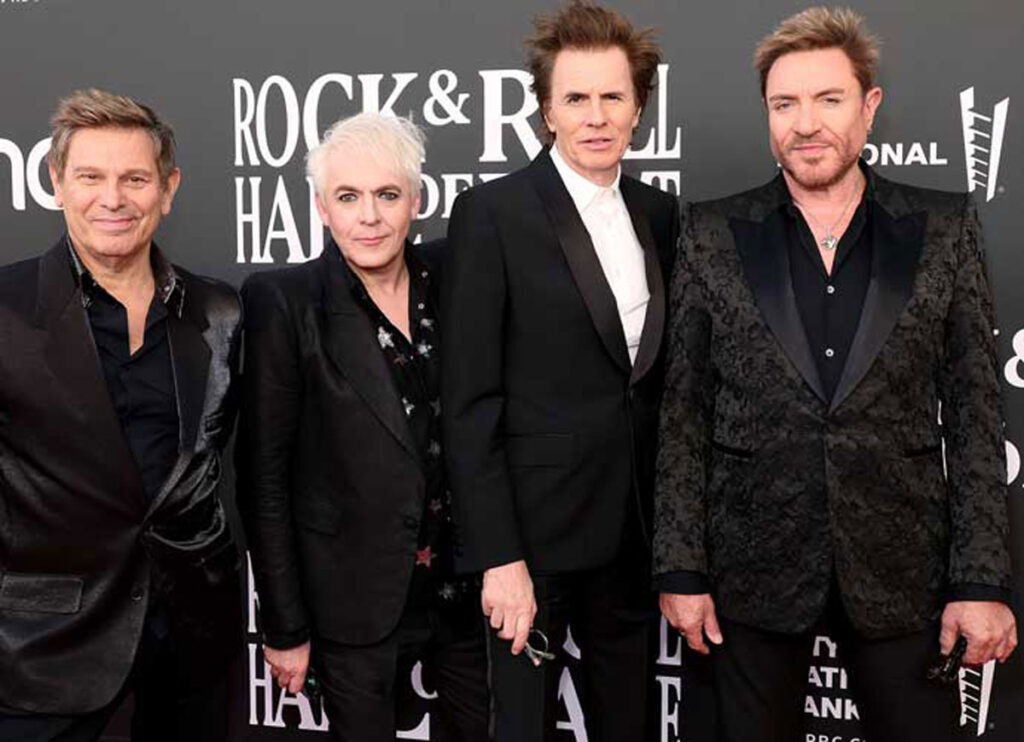 Duran Duran Guitarist Andy Taylor Battling ‘As Hard As He Can’ With Stage 4 Cancer, Simon Le Bon Says
