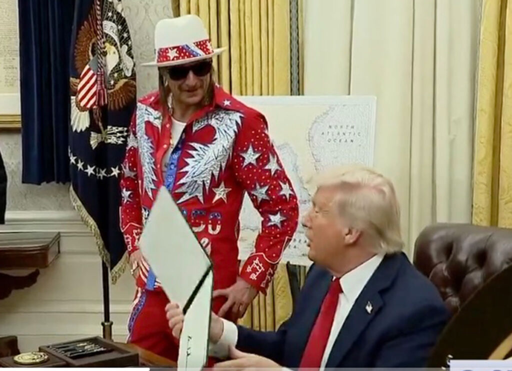 Kid Rock Appears In Oval Office Wearing Red Rhinestone-Studded Suit After Trump Took Exception To Zelensky’s Informal Attire