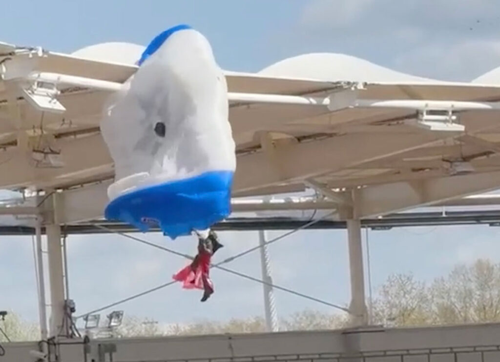 VIDEO: Parachutist Left Dangling From Stadium Roof As Pregame Stunt Goes Awry