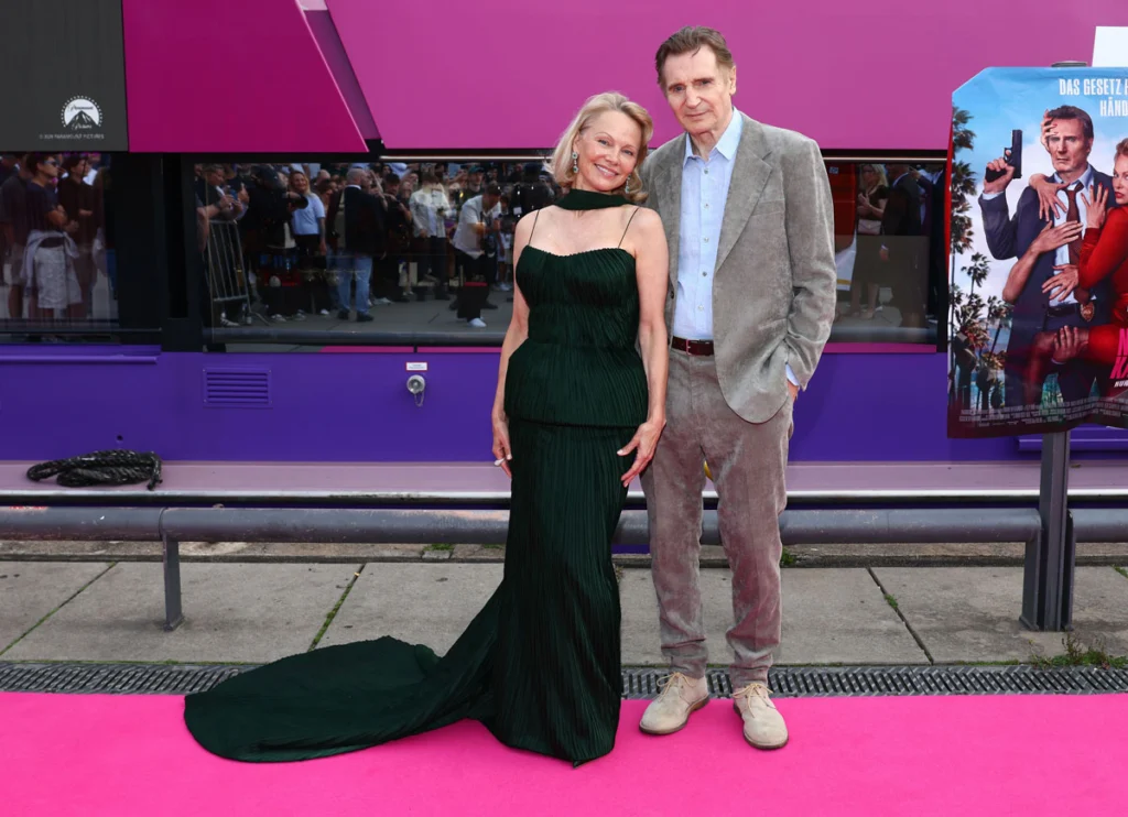 Liam Neeson & Makeup-Free Pamela Anderson Share Kiss At ‘Naked Gun’ Premiere: ‘I’m Madly In Love With Her!’