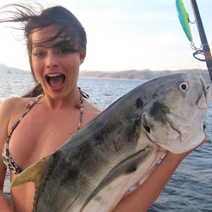 Margot Robbie Rocks Bikini, Poses With Fish Friend